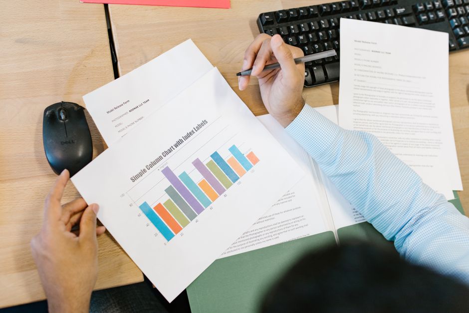 Financial analyst reviewing balance sheets and reserves