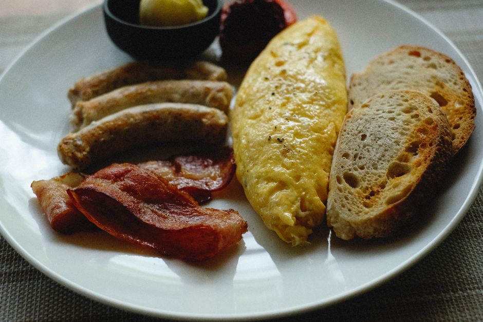 A classic omelet breakfast served with toast and salad