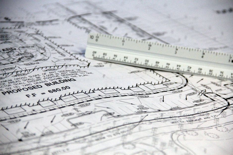 Civil engineer drafting an earthworks plan on a digital tablet