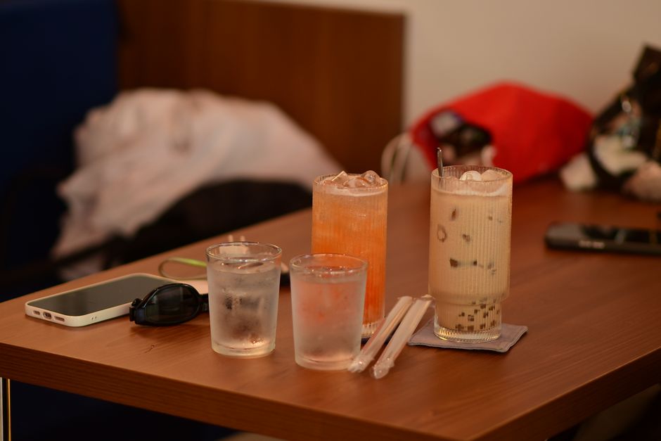 Asian teas and bubble tea on a restaurant table.