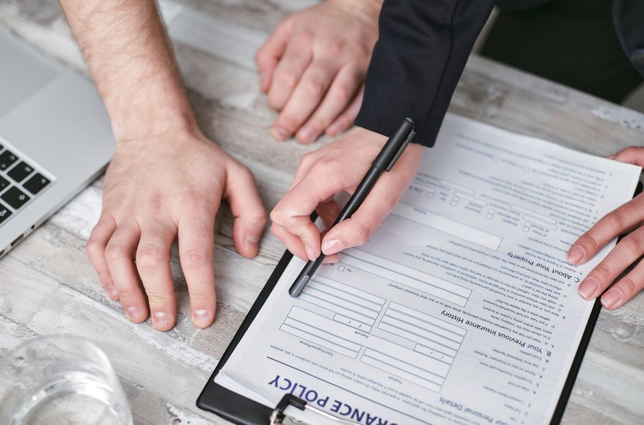 Travel insurance document with suitcase