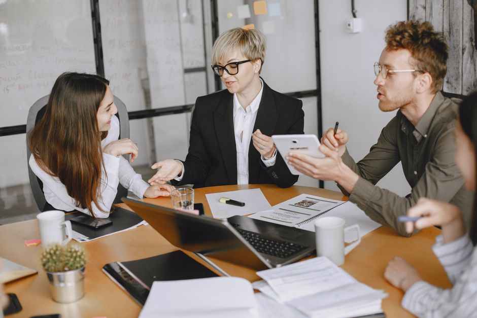 People having a professional conversation in a modern office setting