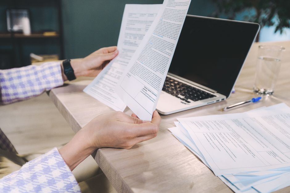 Consultant analyzing operational workflow documents