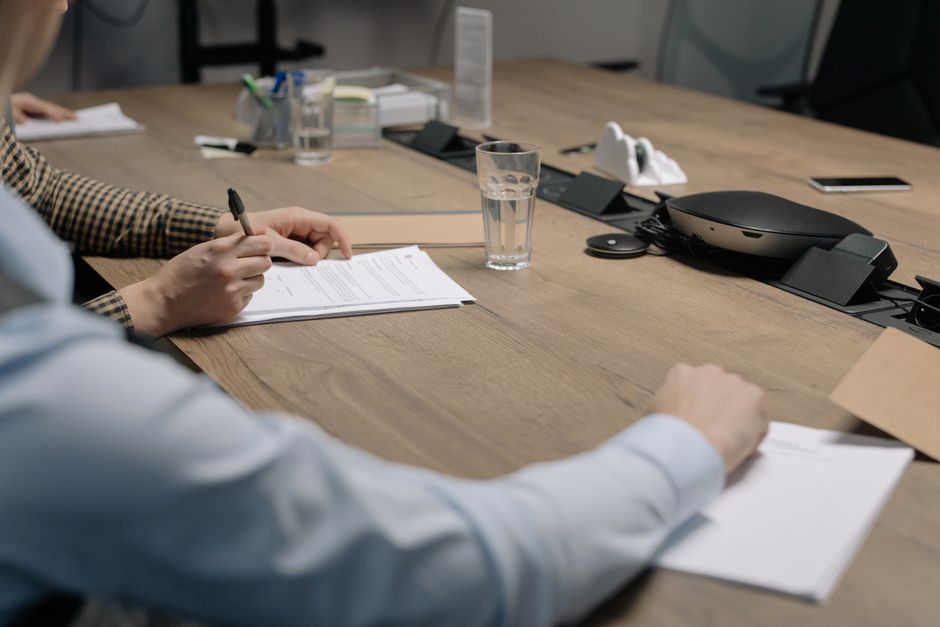 Entertainment format licensing deal discussion at meeting table