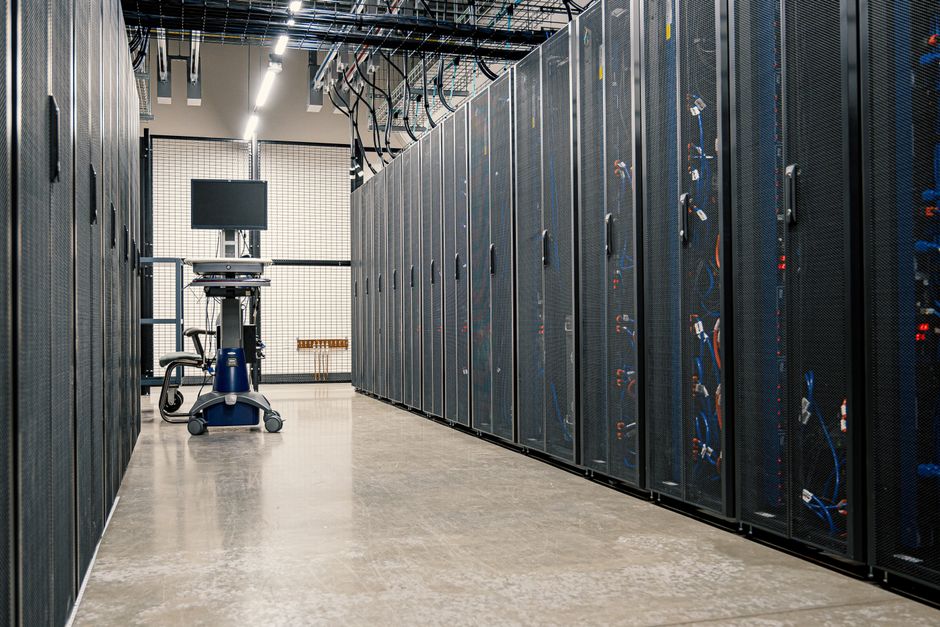 Modern data center with rows of secure hardware racks