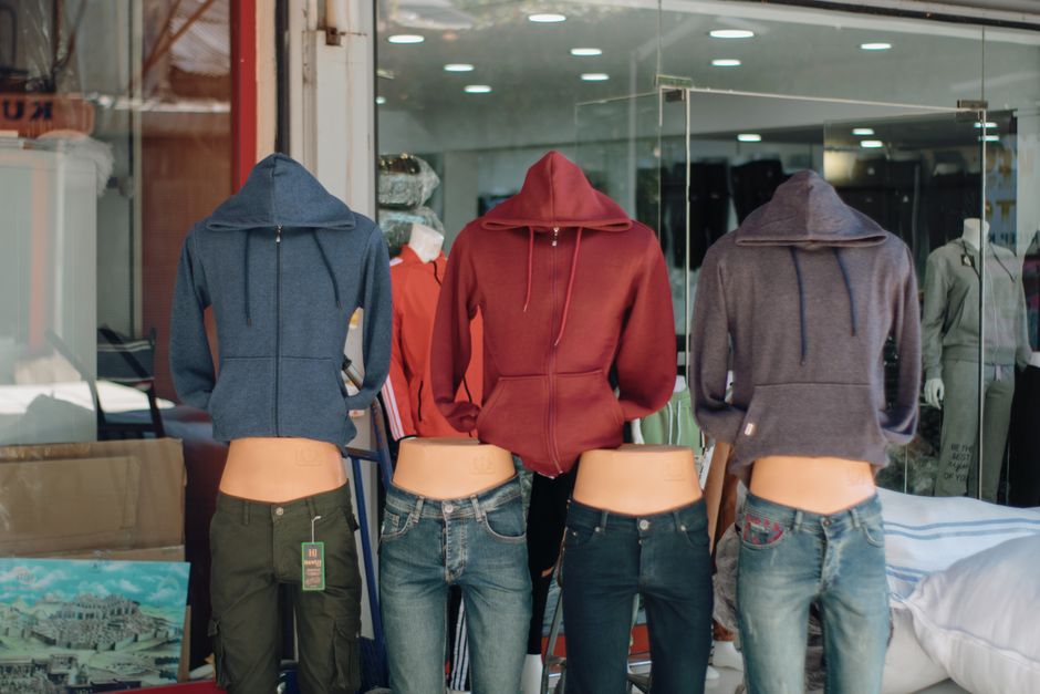 Fishing apparel and gear showcased on mannequins.