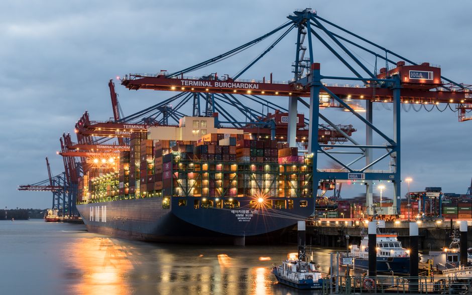 Cargo ship with containers in global port