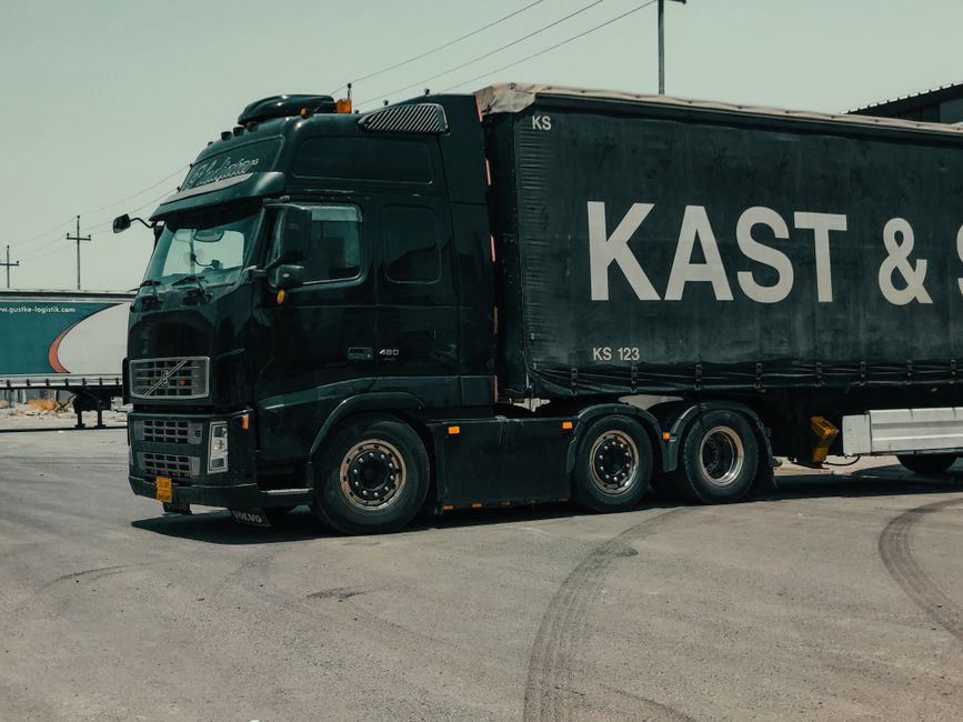 Commercial delivery truck with dry van at a business location