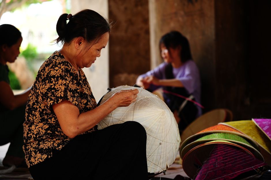 The workshop of a WOC-owned handmade crafts business, with tools and colorful vegan materials.