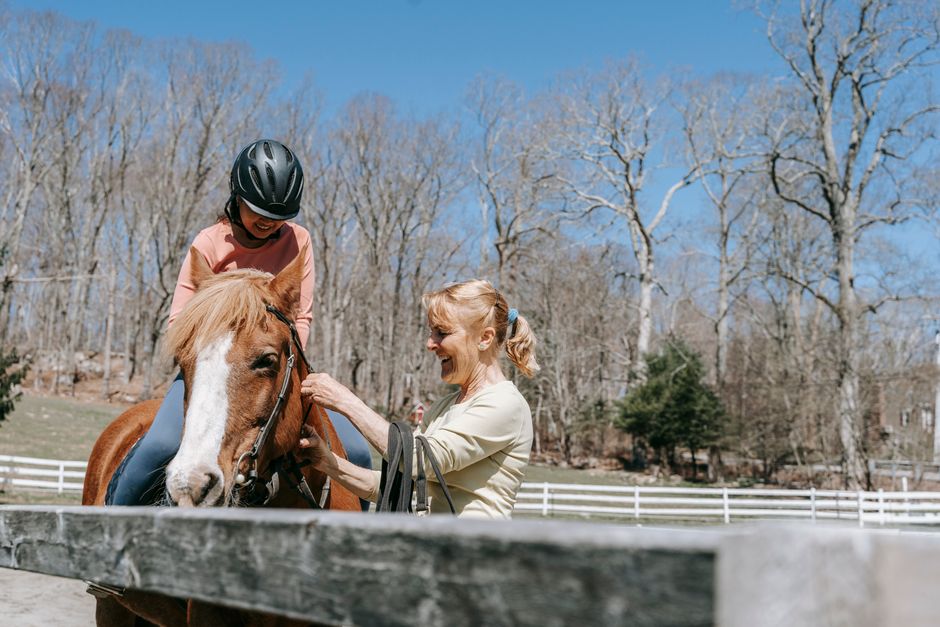 Horse care lesson with instructor and students