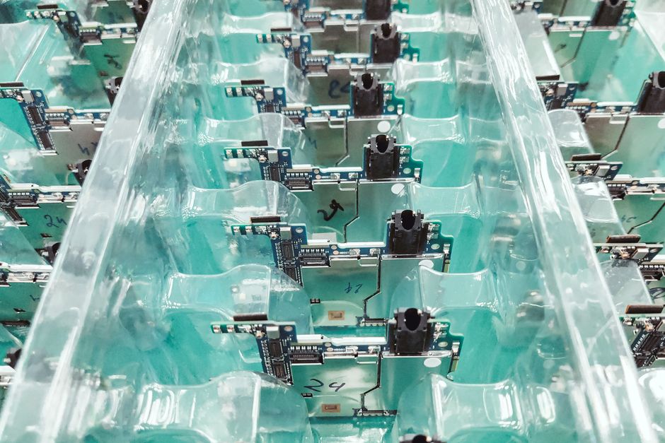 Printed circuit boards being produced in an electronics factory