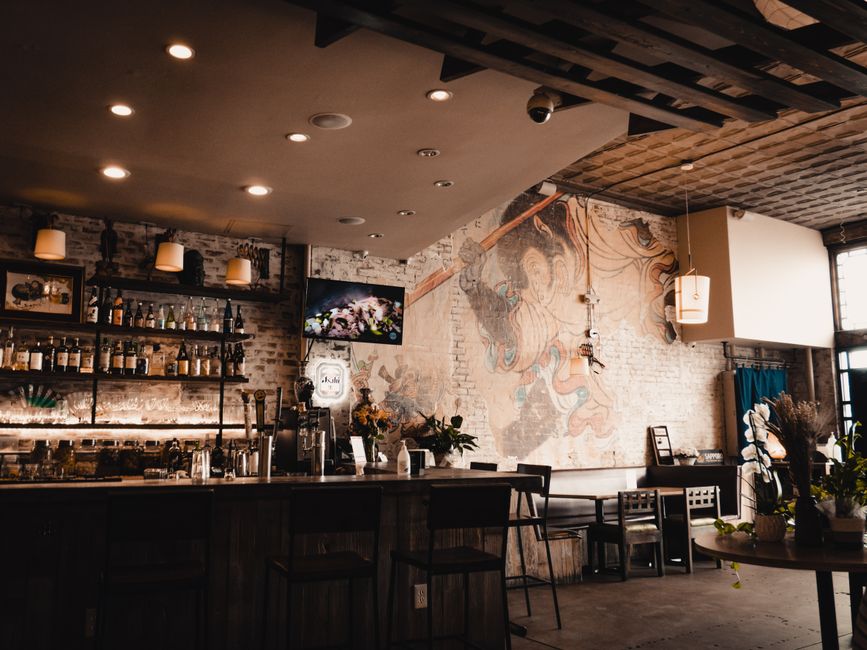 Cafe interior featuring ceiling mural of blue sky