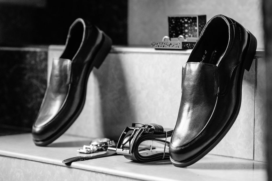 Premium leather dress shoes and sneakers on display