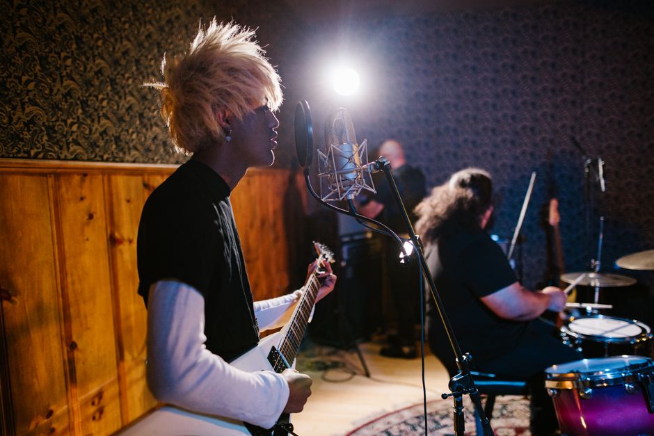 Vintage rock musicians performing in a studio