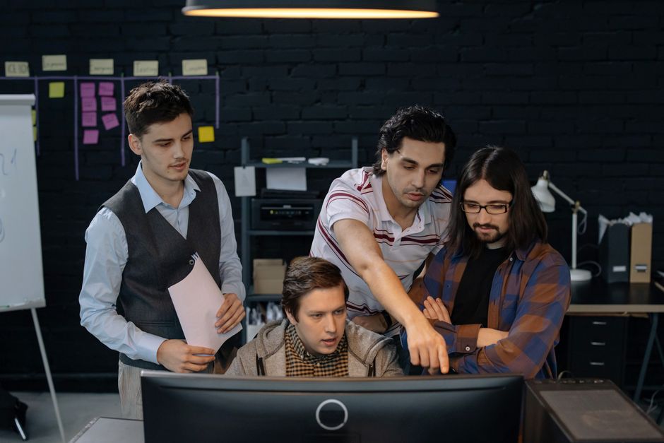 A software development team collaborating in a modern office