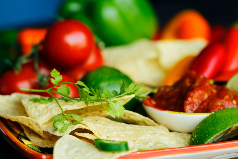 Selection of fresh salsa, chips, and appetizers