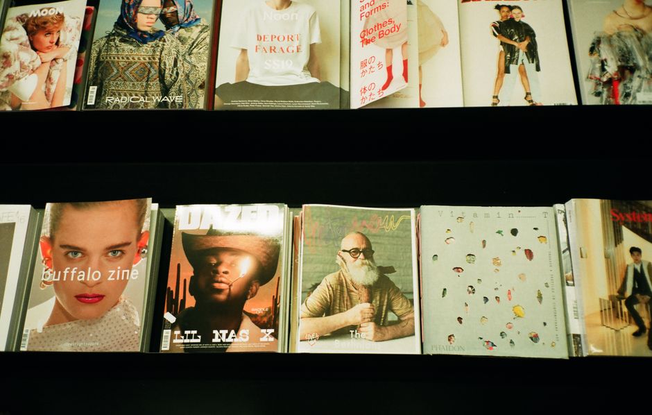 Magazines and DVDs displayed for sale in a retail store