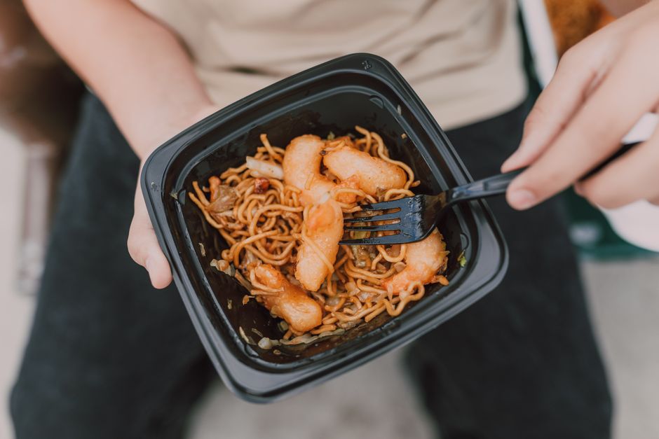 Takeout containers filled with Chinese food