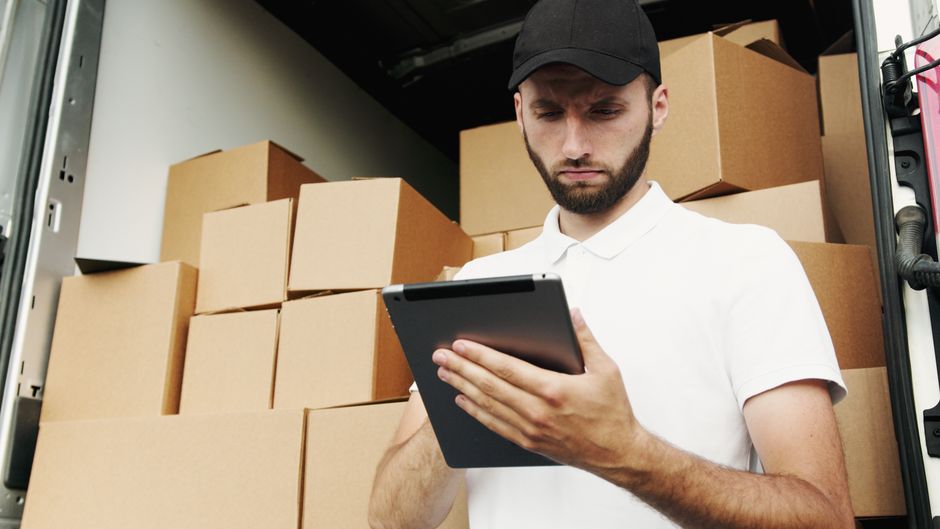 Team implementing digital solutions in logistics office