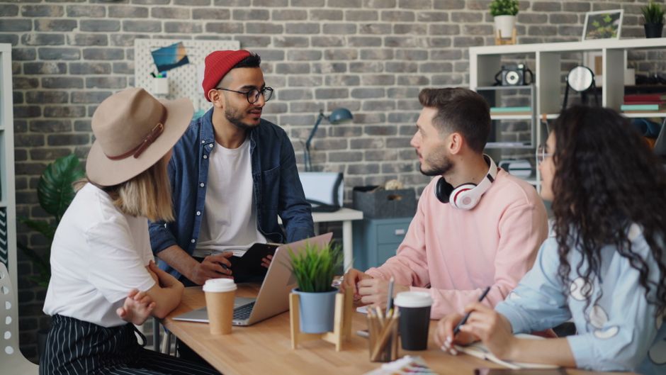 Creative design team collaborating in a modern studio environment